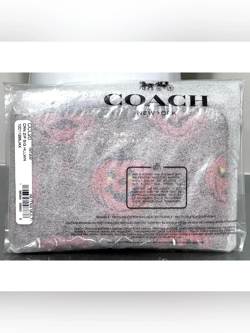 COACH Corner Zip Wristlet In Signature Canvas With PUMPKIN HALLOWEEN PRINT